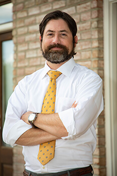 Edward Miller standing outside of his Daphne, AL office